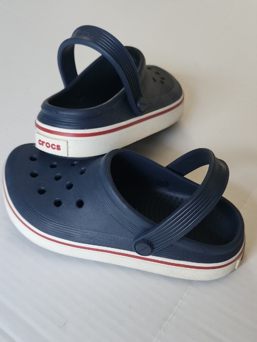 CROCS Kids Navy Clogs with Red and White Trim